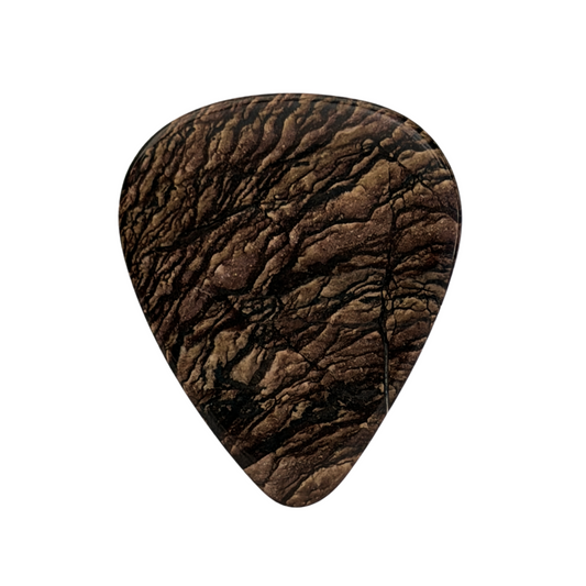 wood patterned handmade stone guitar pick on white background