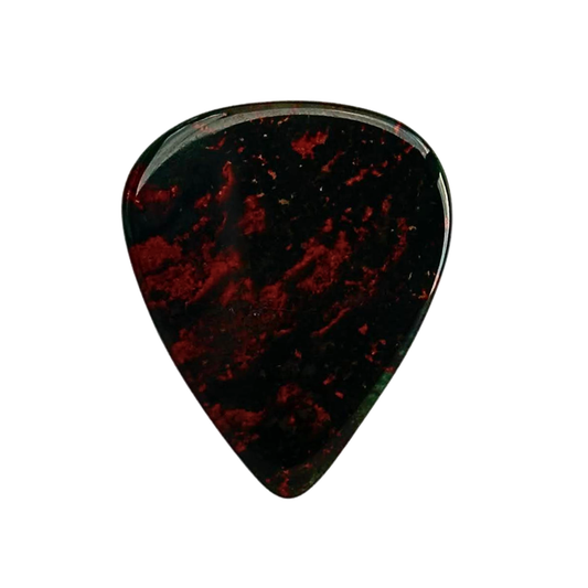dark green and red handmade stone guitar pick on white background