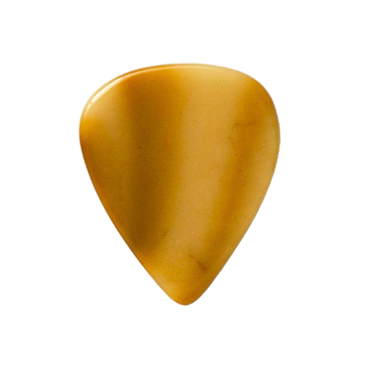 A handmade stone guitar pick with a smooth, polished amber-brown finish, isolated on a solid white background.