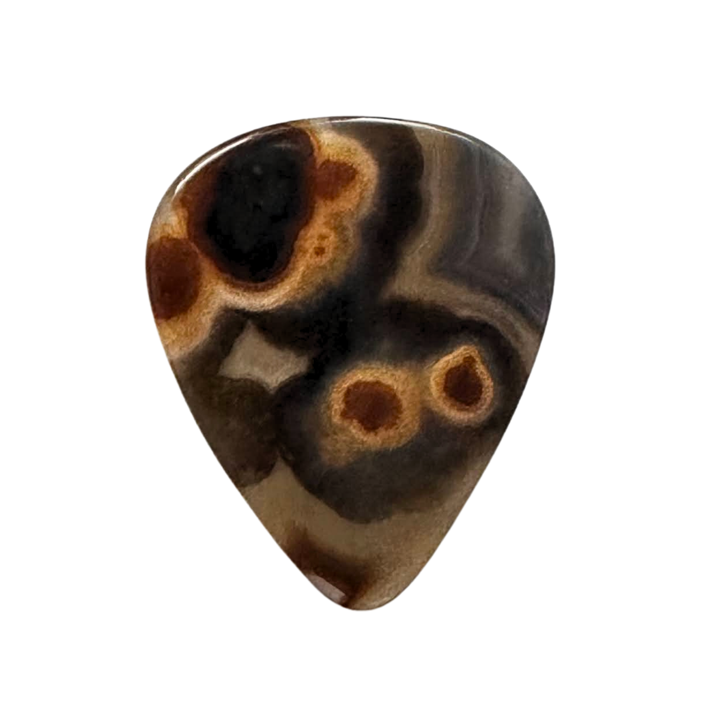 circular patterned black and brown stone guitar pick