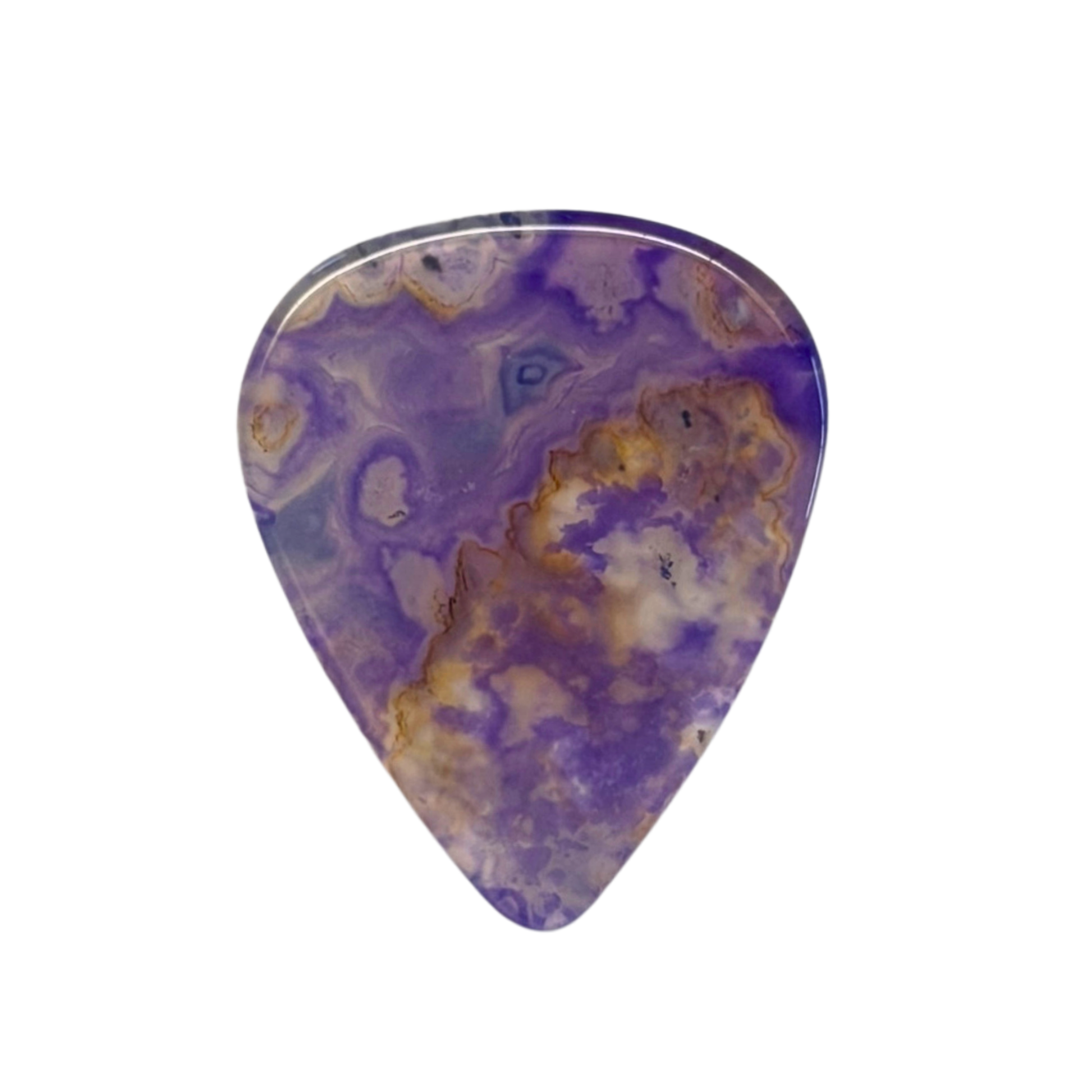 purple with brown handmade stone guitar pick on white background