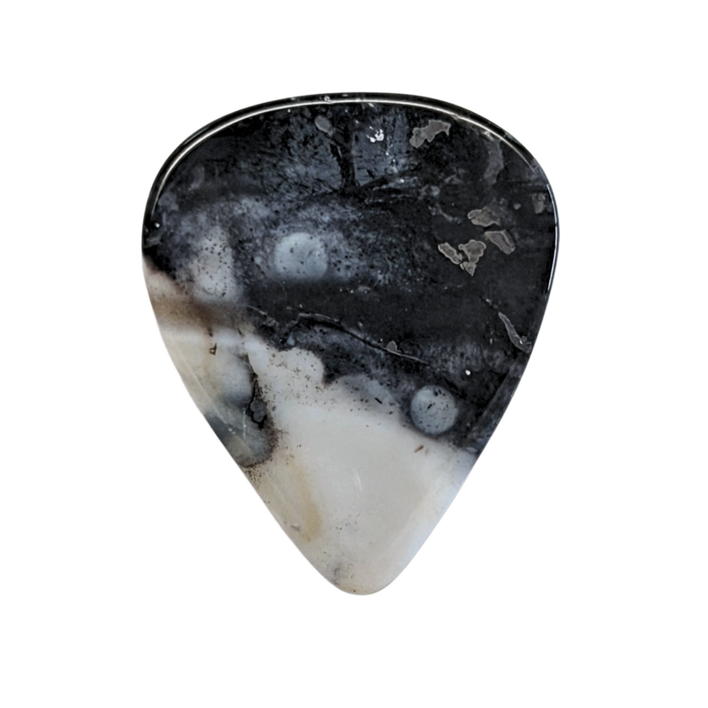 black and white handmade stone guitar pick on white background